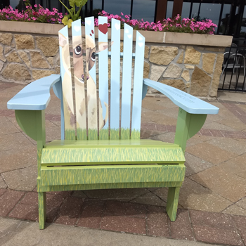 Artist KC has an adirondack chair up for auction in Corinth Square